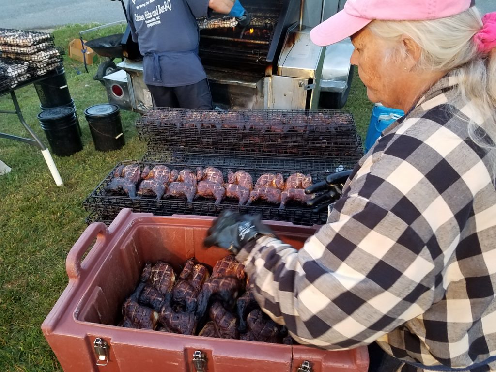 Chickens coming out of the smoker